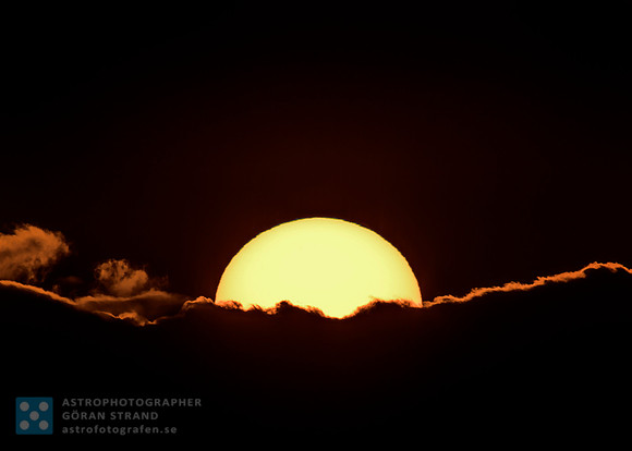 The Sun behind clouds